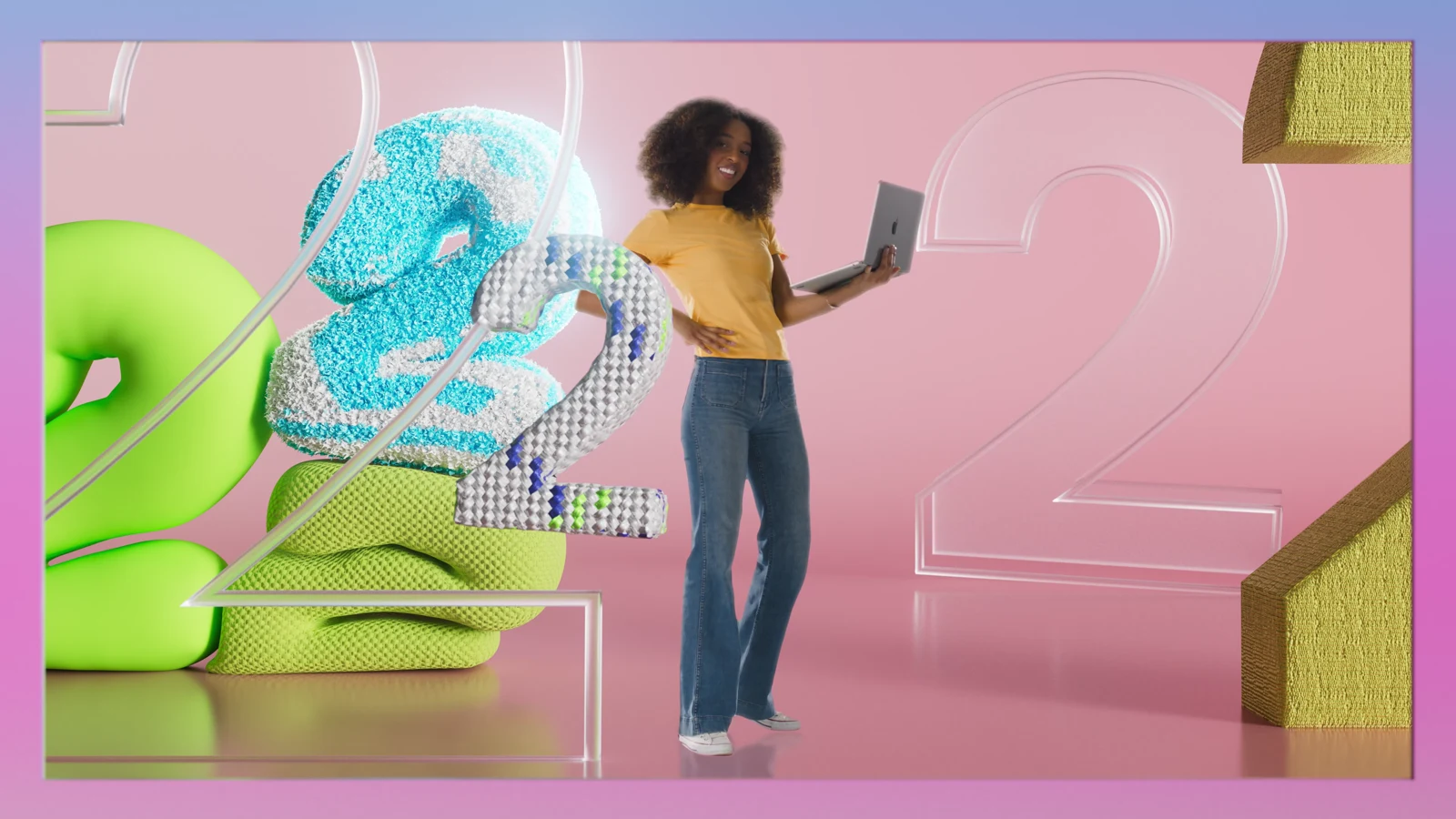 A woman holding a laptop in a pink scene with large number twos