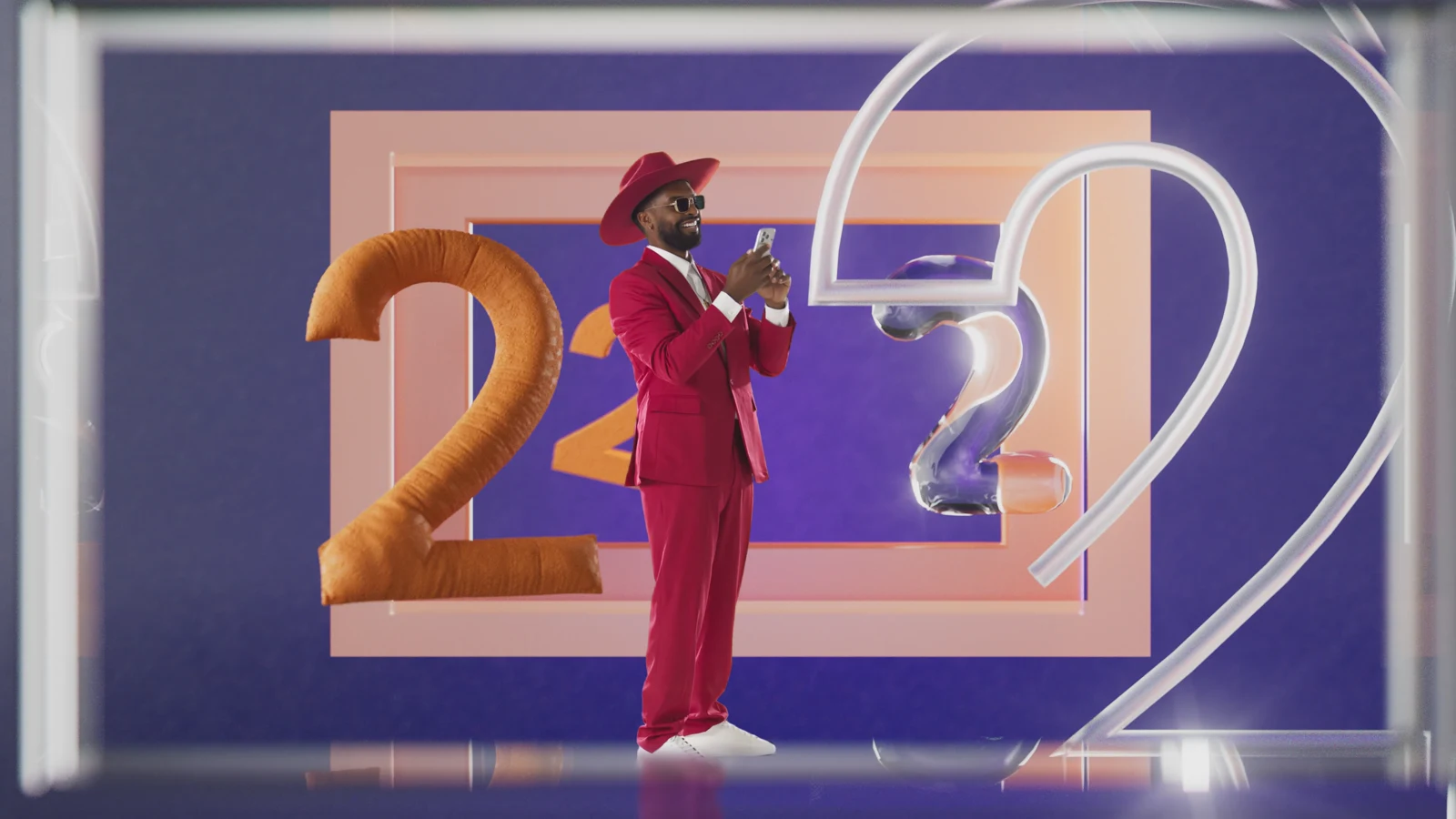A man in a red suit surrounded by number twos